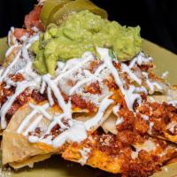 Chorizo Nachos · Heated tortilla chips covered with melted cheese topped with sour cream, pico de gallo, jala...