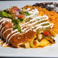 Veggie Enchiladas · Soft corn tortillas stuffed with veggies topped with red chili pepper and tomatillo sauce so...
