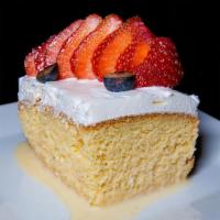 Tres Leches · Our most popular dessert! 
A dense, moist “three milks” cake topped with a light & fluffy cl...