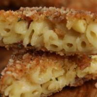 Classic Mac Bites · Home made mac n cheese, breaded and fried, Served with Melt Sauce