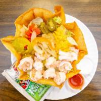Shrimp Tostada Salad · Served in a crispy fresh flour tortilla with iceberg lettuce, jalapeños, tomato, and cheddar...