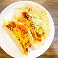 Chicken Taco · Grilled chicken. Fried corn tortilla or soft flour tortilla topped with cheddar cheese and s...