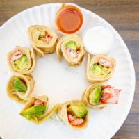 Special Taco Roll · Served with melted cheese, imitation crab sticks, and avocado in a rolled tortilla.