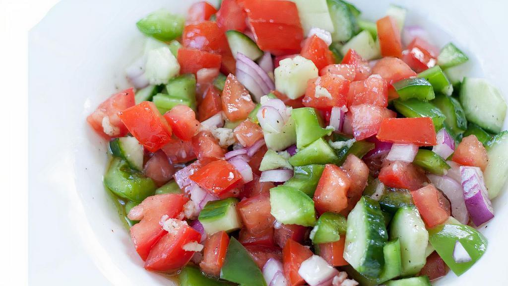 Shepherd Salad · Chopped fresh tomatoes, cucumbers, red onions, green peppers, and parsley with red vinegar lemon juice and olive oil dressing. Add Feta Cheese for an additional charge.