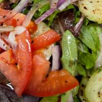 Mediterranean Salad · Lettuce, mixed greens, fresh tomatoes, cucumbers, grape leaves with lemon juice, and olive o...