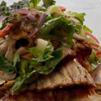 Chicken Gyro · Layers of marinated chicken thigh and breast wrapped around a vertical spit and grilled in f...