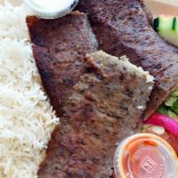 Lamb Gyro (Turkish Doner Kebab) · Ground lamb Turkish style wrapped around a large vertical spit and grilled in front of an in...