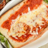Chicken Parmigiana · Made or covered with parmesan cheese.