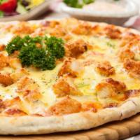 Chicken Parmigiana Pizza · Our fresh, daily made pizza dough topped with golden fried chicken cutlet pieces, house mari...
