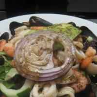 Seafood Salad · Shrimp, calamari, avocado, onions, cilantro, oil and lemon.