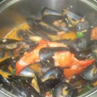 Bisque Mussels · Lobster, brandy tomato, garlic, and cream.
