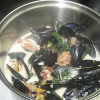 Thai Mussels · Spicy. Curry, coconut broth, lemongrass, kaffir lime, coriander, lime, ginger, and garlic.