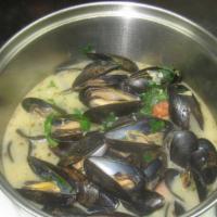 Classic Mussels · White wine, herbs, garlic, butter, tomatoes.