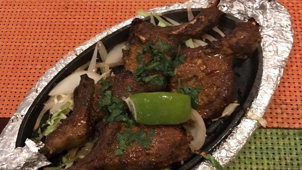 Lamb Chops · Juicy lamb chops marinated with chef’s special Indian spices and yogurt.