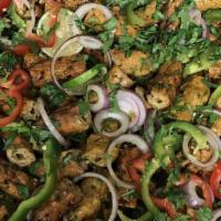 Chicken Seekh Kabab · Ground chicken mixed with onions, herbs, and spices.