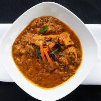 Madrasi Chicken · Boneless chicken cooked with coconut, spices and curry sauce.