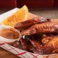 Cajun Fried Chicken Wings · Cajun style: three pieces flap, three pieces drumstick. Served with chipotle sauce and garni...