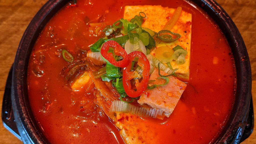 Kimchi Stew 부대찌개 · old style version of kimchi stew BUDAE JJIGAE.
spicy.
served with white rice.
kimchi, scallion, garlic, spam, pork, tofu, onion, house kimchi sauce.
no substitution or addition allowed.