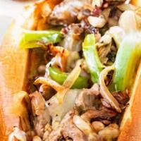 Cheesesteak · Roast beef, American, sautéed onions and peppers, mayo.