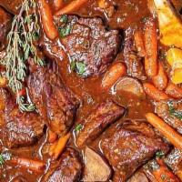 Carne De Res Guisada / Beef Stew · Carne de res guisada con su preferencia de acompañante. / Beef stew with choice of side.