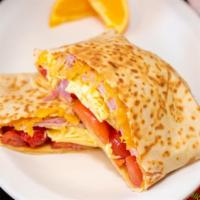 Omelette Crepe · Eggs, ham, roasted red peppers, tomatoes & cheddar cheese.