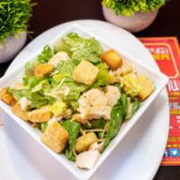 Chicken Caesar Salad · Chopped Romaine lettuce, Sliced Chicken Breast, Parmesan Cheese, Caesar dressing tossed and ...