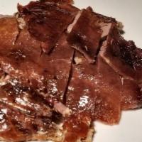 Half Peking Duck · Seasoned Peking Duck Slowly grilled until crispy and golden, with meat carved separating the...