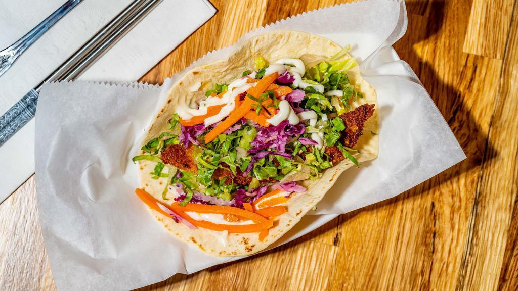 Fish Taco · Crisp fried fish taco served with lettuce, cabbage slaw, carrots, house made sweet citron and truffle mayo sauce.