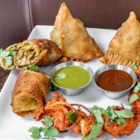 Atithi Special Platter · Vegetable samosa, chicken samosa, lamb spring roll and pakora served with mint and tamarind ...