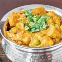 Aloo Gobi Mutter · Combination of cauliflower, potatoes & peas cooked in Indian spices.