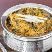Chicken Saag · Chicken and spinach cooked with garlic, onions, and spices