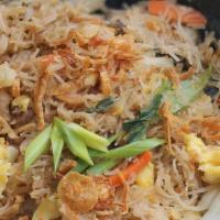 Singapore Noodles · Vegetarian. Wok-fried thin rice noodles, mixed vegetables, shredded egg, scallions, crispy o...