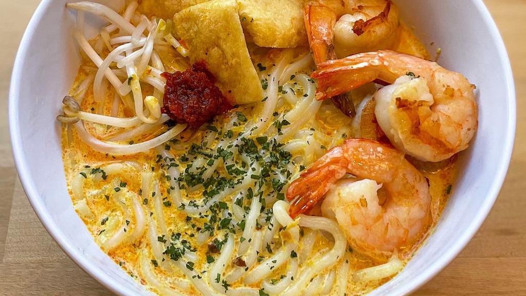 Laksa Noodles (Soup Version) · Our signature dish now comes in a soupy version! Slow-cooked coconut shrimp soup, thick rice noodles, bean sprouts, tofu puffs, and crispy onions. Contains the following : crustaceans, dairy, tree nuts. Recommended protein: Shrimp.