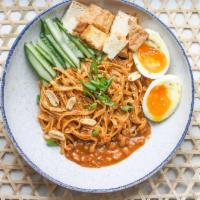 Satay Peanut Noodles · Creamy satay peanut sauce, wide egg noodles, soft-boiled egg, cucumbers, scallions and crisp...