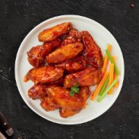 Buff Flying Chicken · Wings cooked and tossed in our buffalo wing sauce. Served with Blue Cheese.