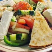 Horiatiki Salad · Village salad: cut small, chunks of feta, tomatoes, cucumbers, onions and olives tossed topp...