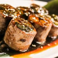 Beef Negimaki · Broiled sliced steak rolled with scallions in teriyaki sauce.