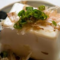 Yakko Tofu · Cold Japanese tofu with scallion and bonito sauce.