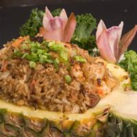 Pineapple Fried Rice · Diced fresh pineapple, scallop, shrimp, crabstick, and eel. Served with soup.