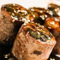Beef Negimaki · Sliced beef rolled with scallion and broiled with teriyaki sauce.