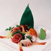 Sashimi Deluxe · 20 pieces of assorted raw fish.