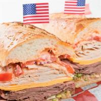 The Bruce · Turkey, roast beef, Vermont cheddar, roasted red peppers, lettuce, red, onion, hot pepper ma...