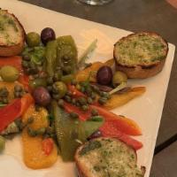 Italian Roasted Peppers · With capers, olives and toasted garlic bread.