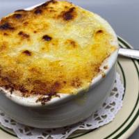 French Onion Soup · French onion soup with caramelized onion and melted swiss cheese.