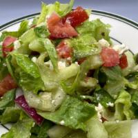 Mediterranean Salad · Mediterranean salad with cucumbers, tomatoes, radish, olives & feta cheese with lemon vinaig...