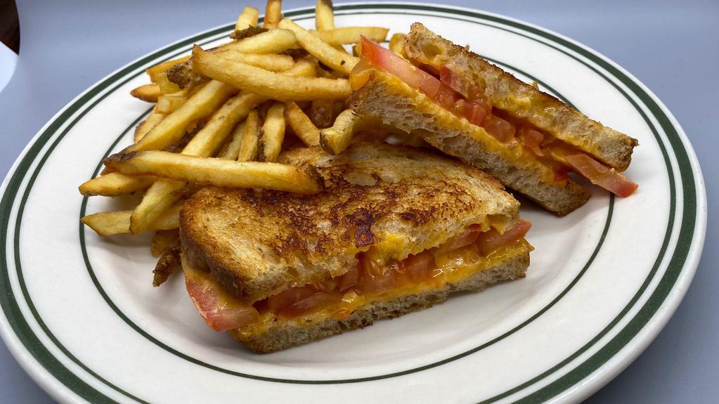 Grilled Cheese · Grilled cheddar cheese and tomato on Amy's sourdough bread with french fries.