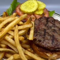 All Natural Lafrieda Hamburger · Hamburger on Amy's bread bun with tomato, lettuce & onion with french fries.