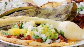 Quesadilla Al Pastor · Filled with roast pork, cilantro, raw onions and melted Oaxaca cheese.