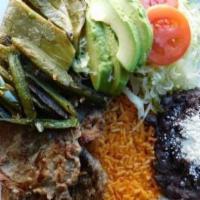 Plato  · Served with rice, refried beans, cotija cheese, sautéed jalapeno peppers, cactus, lettuce, t...