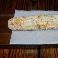 Elote Mexicano  · Corn on the Cob with mayonnaise, mild chili powder and cotija cheese.